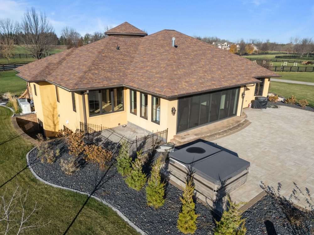 Outdoor living space with Bullfrog hot tub, Appleton WI estate