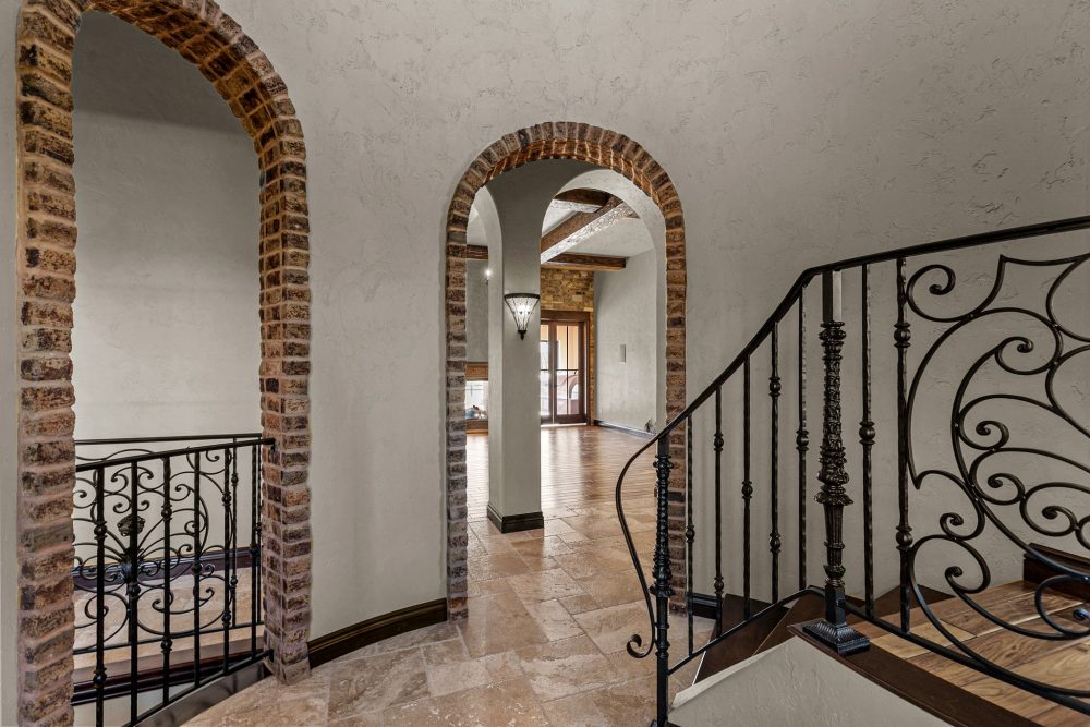 Grand entryway with custom steel/iron door, 19’ ceilings, Appleton WI estate