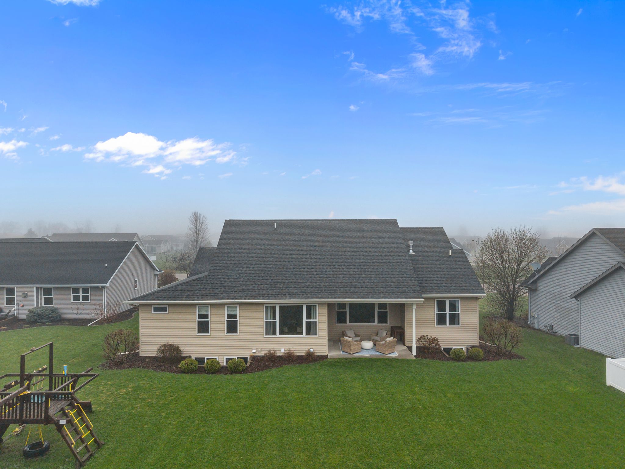 Aerial rear view of the home at W6681 Charleen Ln in Greenville, WI