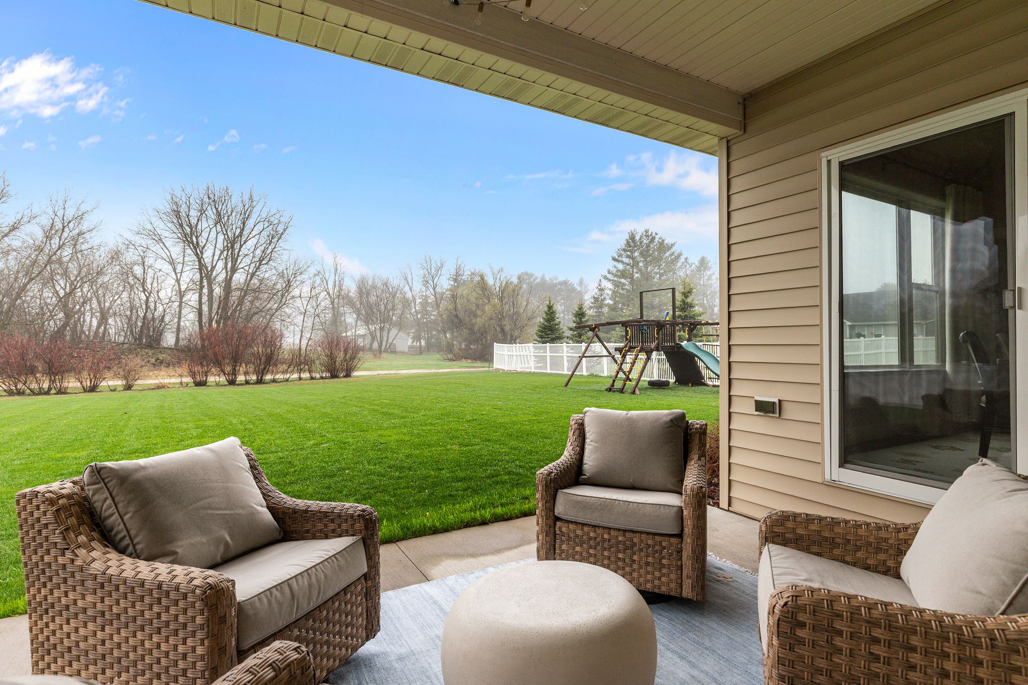 Covered back patio overlooking the backyard at W6681 Charleen Ln in Greenville, WI