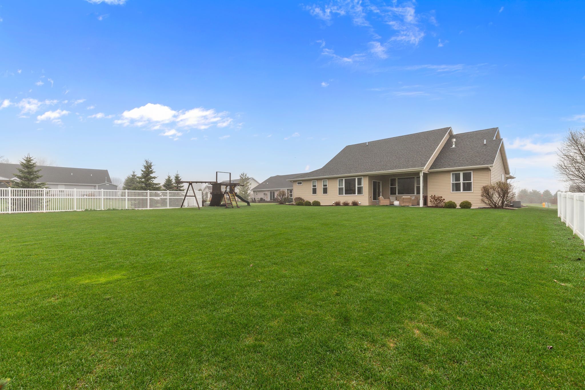 Wide backyard view of the home at W6681 Charleen Ln in Greenville, WI