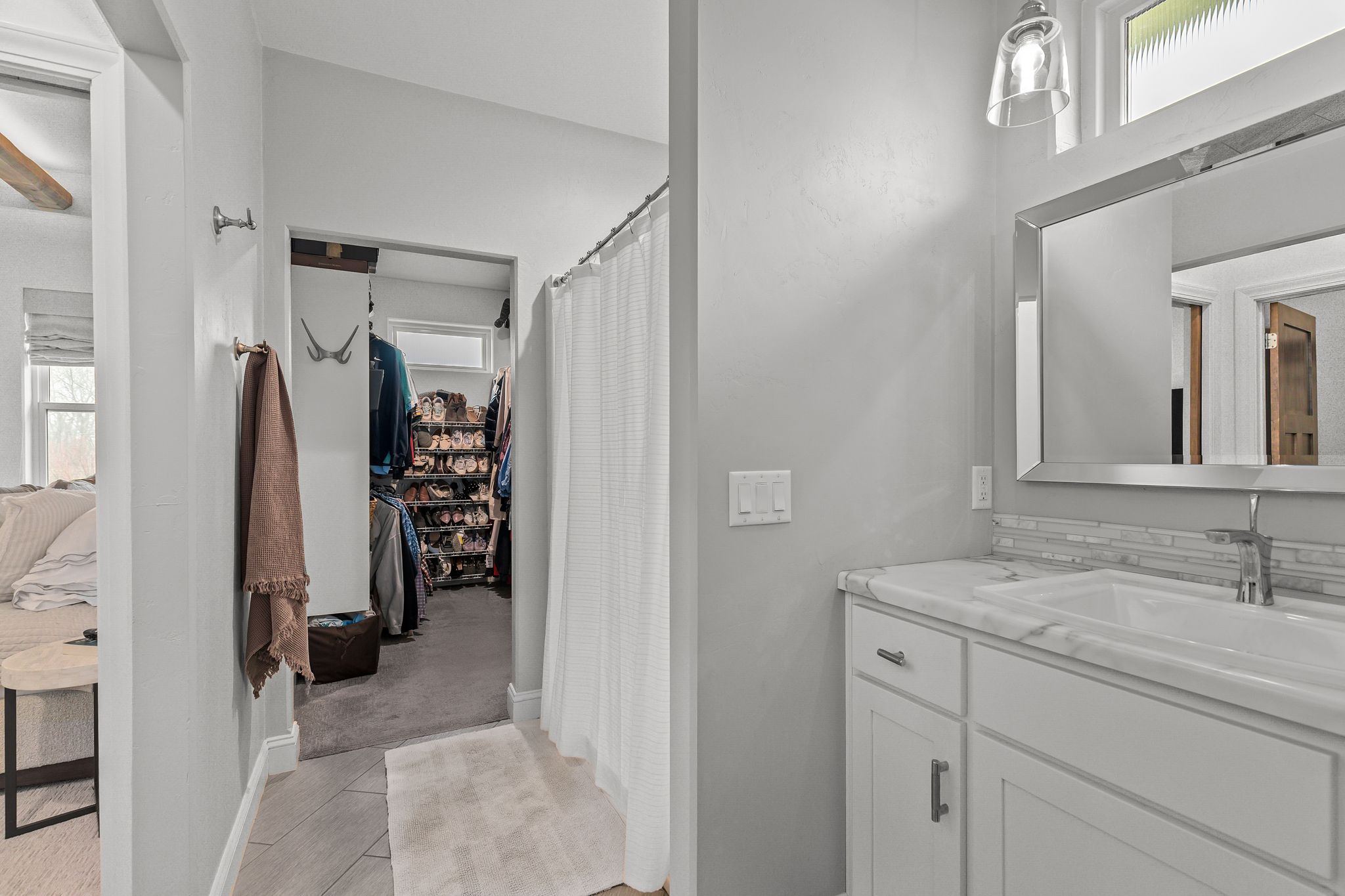 Primary bathroom with access to the walk-in closet at W6681 Charleen Ln in Greenville, WI