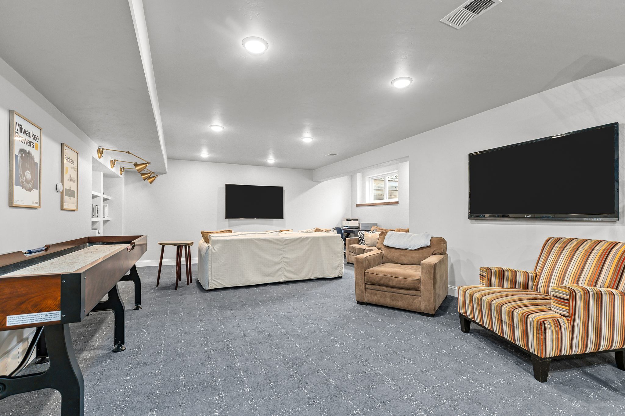 Long view of the finished lower-level rec room at W6681 Charleen Ln in Greenville, WI